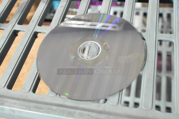 PS4 NBA 2K19 game disc in good condition on a gray metal shelf, reflecting light.