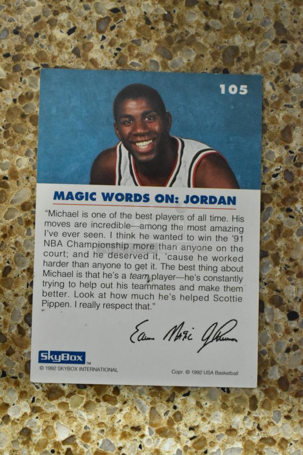 SkyBox 1992 basketball card featuring Magic Words on Jordan, signed by Magic Johnson, in excellent condition.