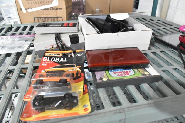 6 various items including Coolbaby RS-41 game console, Global Matchbox cars, Nintendo DS with games; good condition.