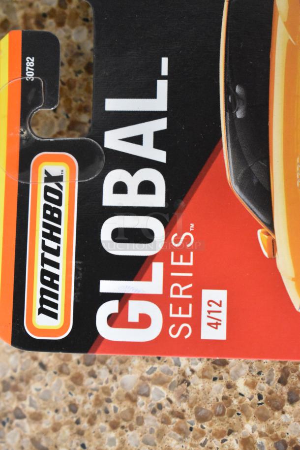 Matchbox Global Series packaging, showing logo and series number 4/12, featuring a partially visible yellow car.