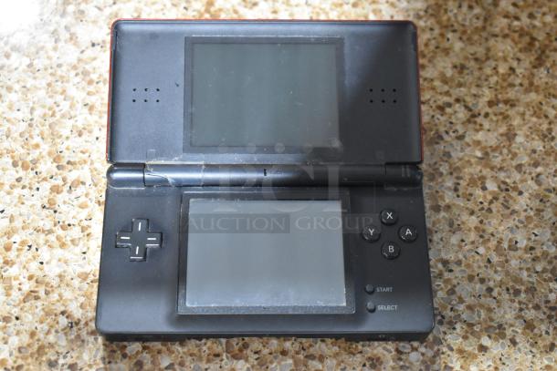 Nintendo DS game console, showing screens and buttons, moderate wear, part of 6-item auction lot.