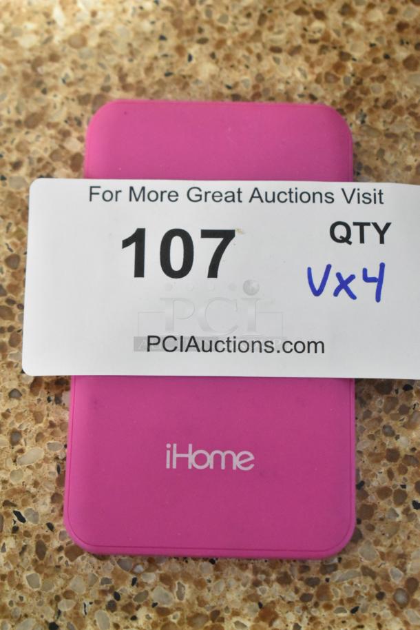 iHome IH-W-PP2058 pink device labeled "107 QTY Vx4." Auction details on PCIauctions.com card.