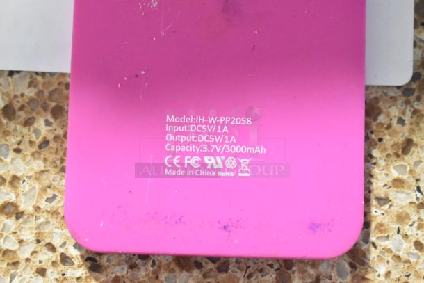 Pink Apple IH-W-PP2058 iHome with visible model and capacity markings, 3000mAh, made in China. Slight wear shown.
