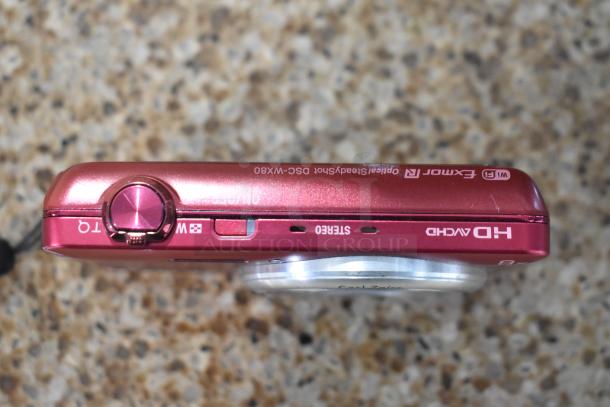 Red Sony Cyber-shot DSC-WX80 digital camera, features WiFi, HD AVCHD, Exmor R, Carl Zeiss lens. Good condition.