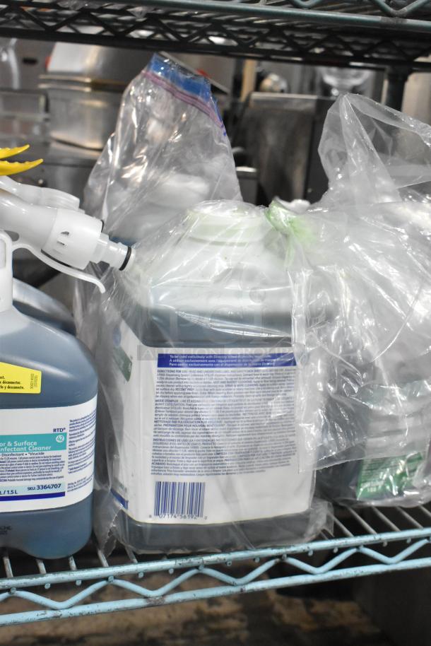 Two-tier lot of cleaning supplies, including Diversey Wiwax Emulsion, Restroom Cleaner, and Scott Foam Skin Cleanser, on shelf.