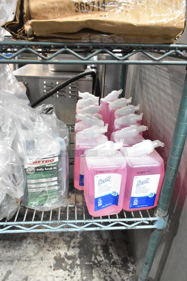 Two-tier shelf with Diversey Wiwax, Diversey Restroom Cleaner, and Scott Foam Skin Cleanser bottles in good condition.
