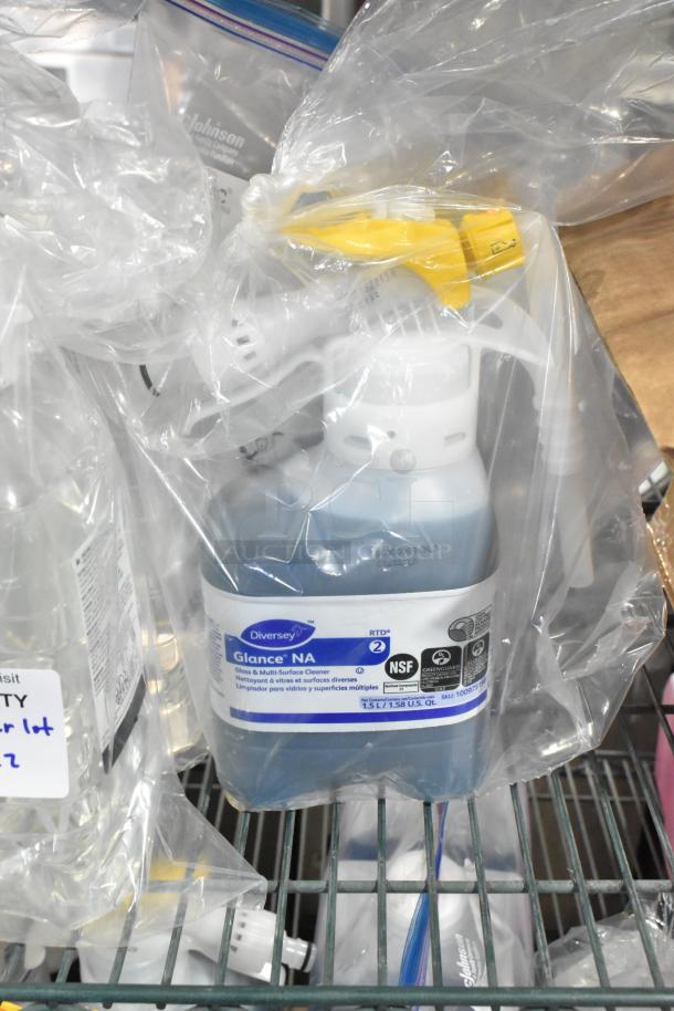 Two-tier lot of cleaners including Diversey Wiwax Emulsion, Diversey Restroom Cleaner, Scott Foam Cleanser. Mixed condition.