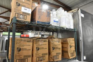 Two-tier lot with Diversified Chemical Technologies Oven Shield boxes and Scott Foam Skin Cleanser bottles on metal shelving.