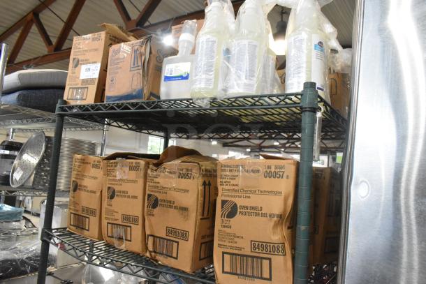Two-tier shelf with various items including oven shields in labeled boxes and bottles of Scott Foam Skin Cleanser.