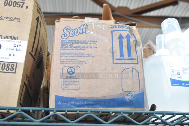Two-tier lot with Scott Foam Skin Cleanser, 6L boxes marked as eco-certified. Additional items include oven shields.