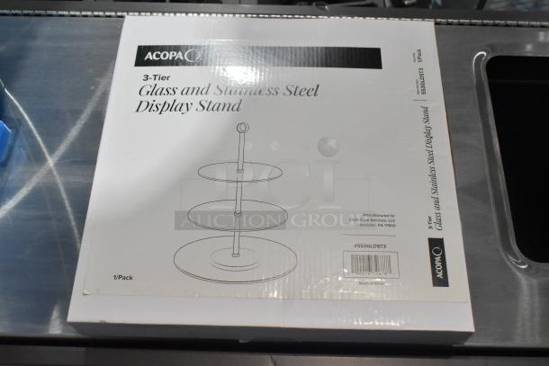 Acopa 3-Tier Glass/Stainless Steel Display Stand box, model 553GLDST3, new, slight scratch/dent, for auction.