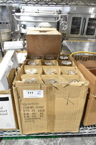 Boxes containing new Carlisle 564607 Alibi 9 oz. plastic martini glasses and scratches, dented packaging, 24 per case.