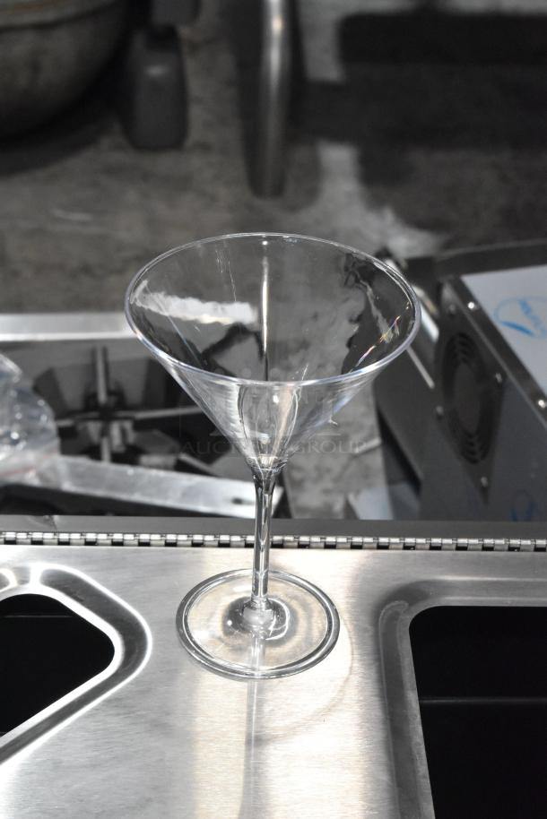 Carlisle 564607 Alibi 9 oz. plastic martini glass on a metal counter, brand new condition.