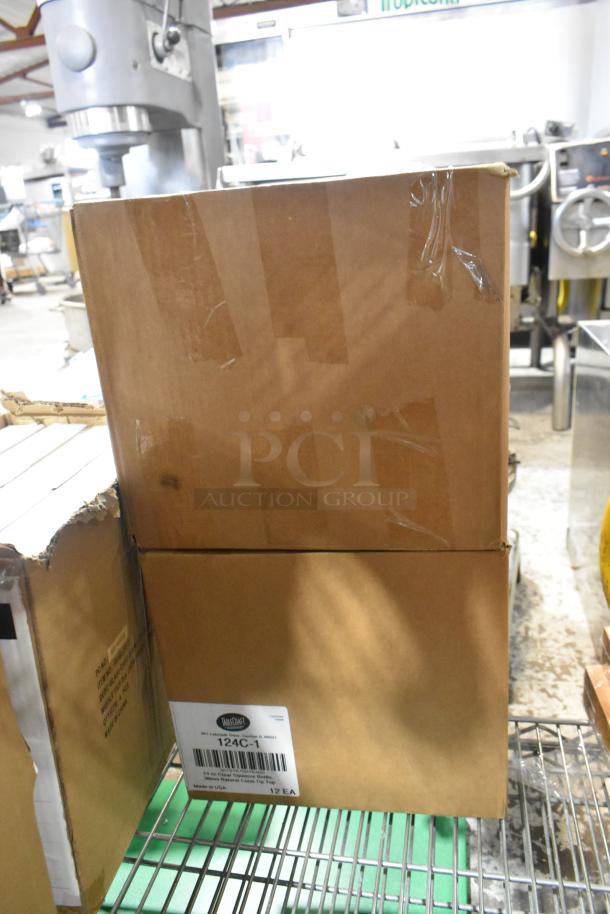 Cardboard boxes labeled "Tablecraft 124C-1" containing new squeeze bottles; part of auction lot with martini glasses.