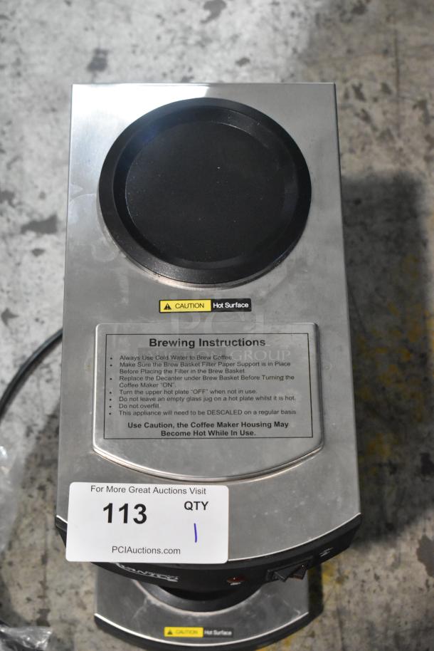 Brand new Avantco 177C10 stainless steel 12-cup pourover coffee maker with 2 warmers, 120V, with caution label visible.