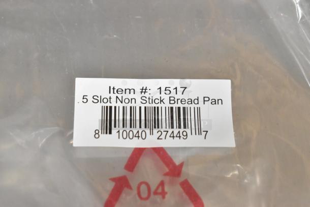 Label of item #1517, 5 Slot Non Stick Bread Pan, showing barcode and recycling symbol, part of auction lot.