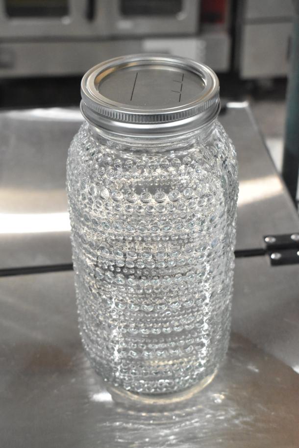Clear glass jar with textured dot pattern, metal screw cap, brand new, part of auction for 9 scratch and dent items.