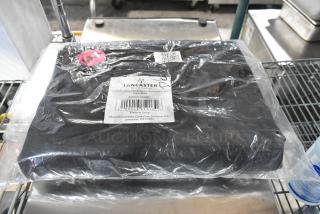 Brand new 9' Raven Black umbrella canopy by Lancaster Table & Seating, model 427UMCAS09BK, in packaging.