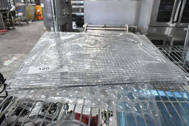 Five new 17.5" x 17.5" Assure 190FS175175 mesh fryer screens, Pitco P6072186 equivalent, in packaging on a rack.