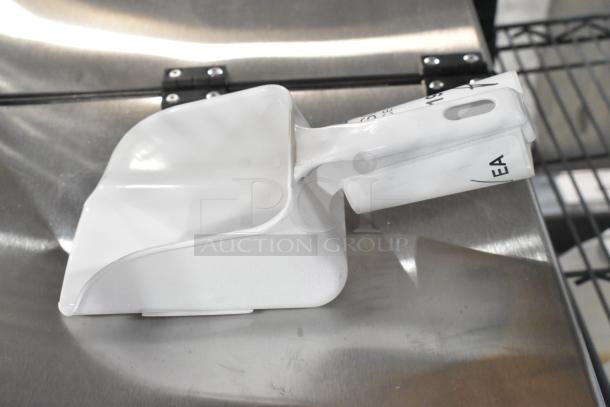 Avantco ice scoop, brand new condition, white finish, minor scratch and dent markings, includes label "EA."