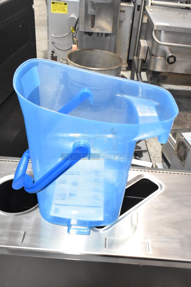 San Jamar blue poly ice bucket, new with minor scratches. Durable design, ergonomic handle, 6-gallon capacity.