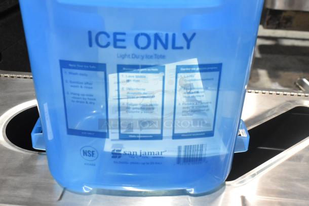 "San Jamar blue poly ice bucket, brand new with minor scratches, 'ICE ONLY' label, NSF certified, 25 lbs capacity."