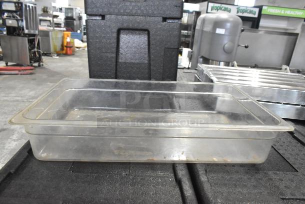 Lot of items: Clear plastic bin, metal grease hood filters, and metal mixing cups. Used condition, industrial setting.