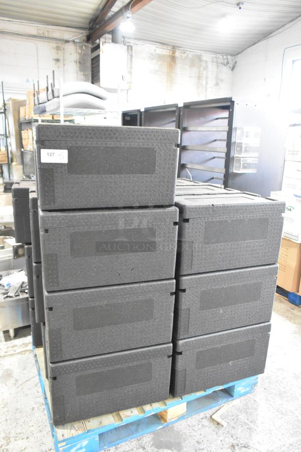 19 Polyfoam black insulated portable coolers stacked on a pallet, each marked with tag 127, in excellent condition.