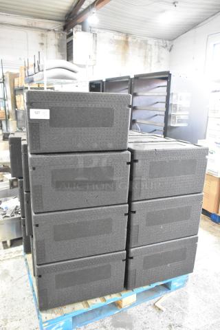 19 Polyfoam black insulated portable coolers stacked on a pallet, each marked with tag 127, in excellent condition.