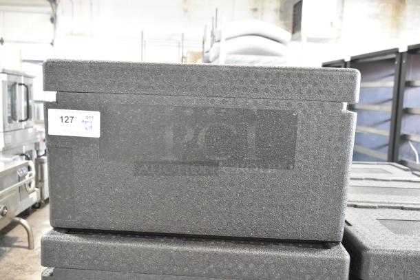 19 black polyfoam insulated portable coolers, stackable. Label reads "QTY Apprx. x19." Ideal for transport and storage.