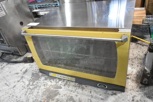 Cadco Unox XAF195 stainless steel countertop convection oven, electric-powered, visible control panel, commercial use.