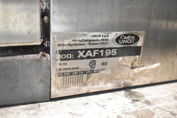 Cadco Unox XAF195 convection oven label showing model, safety certifications, and manufacturer details.