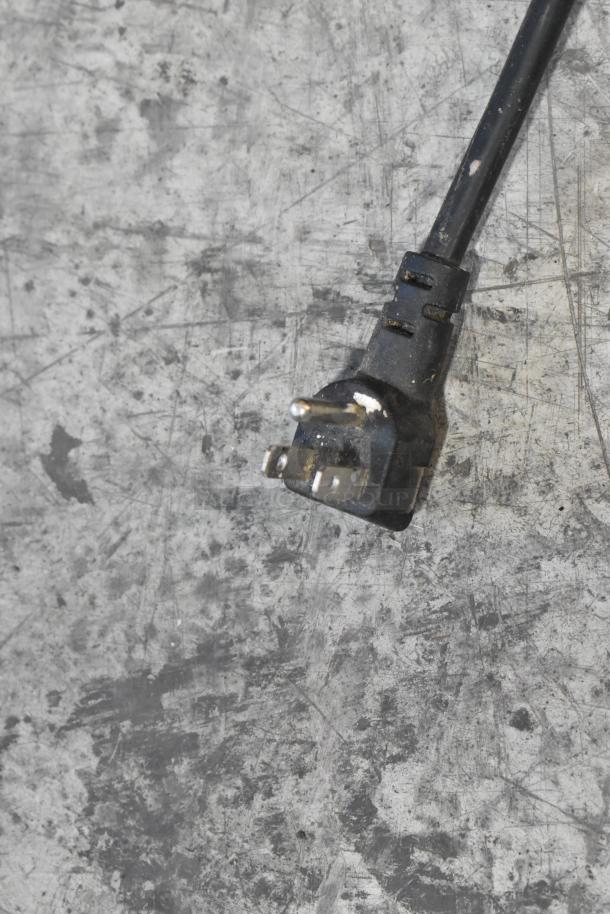 Close-up of a power plug on a stainless steel ice machine. Model EP21967 by Costway, commercial use, 115 volts, 1 phase.