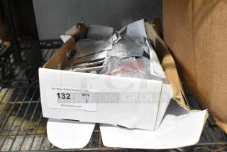 Lorex LDC7708PK4B Dome Camera in box, contains labels and packaging materials, auction lot number 132.