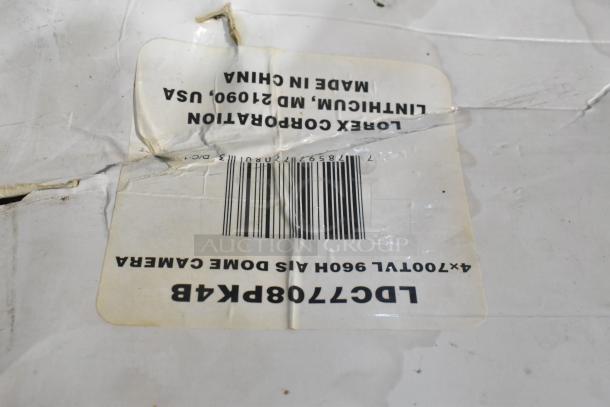 Cracked and worn box label for Lorex LDC7708PK4B Dome Camera, includes barcode, made in China.