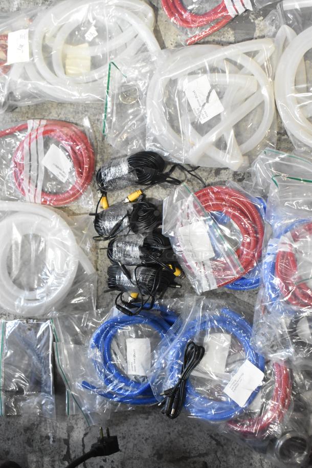 Lot of brand new hoses and stacking kits, various colors. Items are in original packaging with some labeled as scratch and dent.