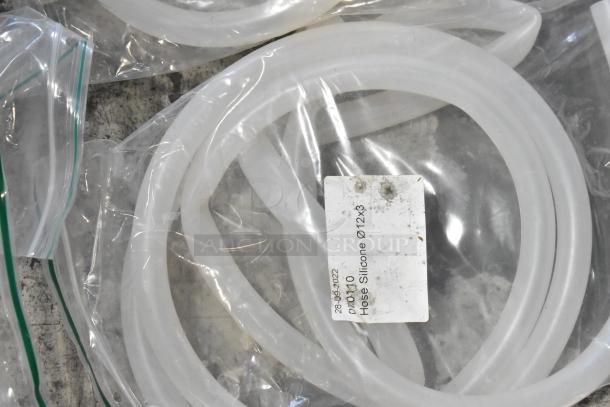 Lot of silicone hoses labeled "Hose Silicone Ø12x3" in plastic bags. Brand new with minor scratches and dents. Includes stacking kits.