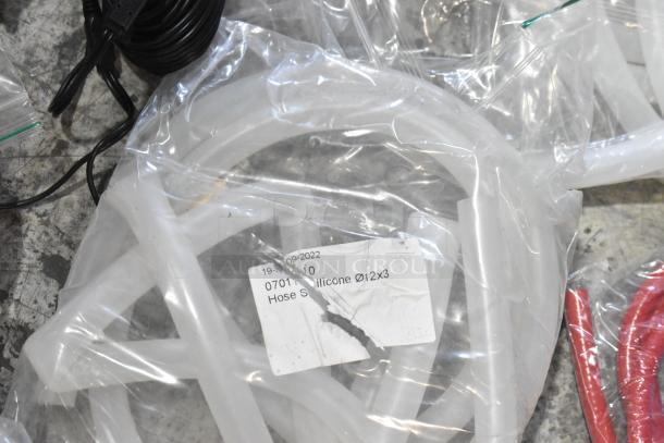 Lot of brand new scratch and dent items, including silicone hoses and stacking kits. Hose labeled Ø12x3.
