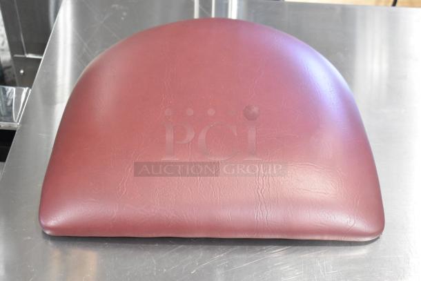Maroon seat cushion, brand new with slight scratches, shown on a metallic surface. Auction of four identical items.