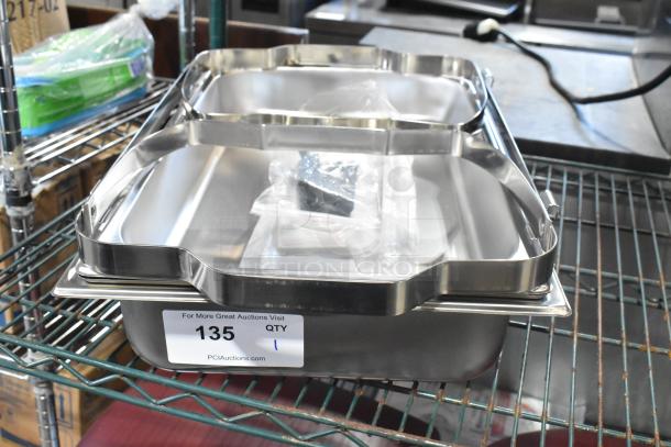 Brand new stainless steel chafer with drop-in bin and lid, minor scratches. Item tag: 135, quantity: 1.