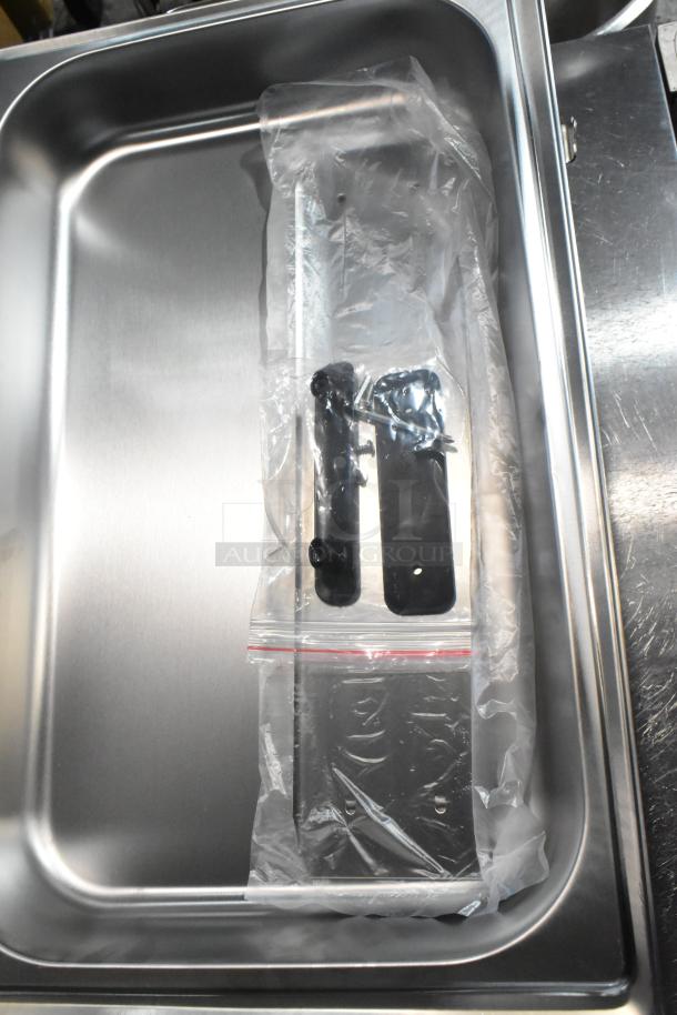 Stainless steel chafer with drop-in bin and lid, new with minor scratches. Includes packaged hardware.