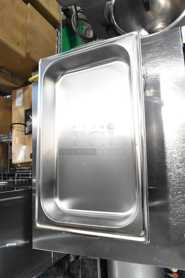 Stainless steel chafer with drop-in bin and lid, brand new with minor scratches, glossy finish, robust build quality.