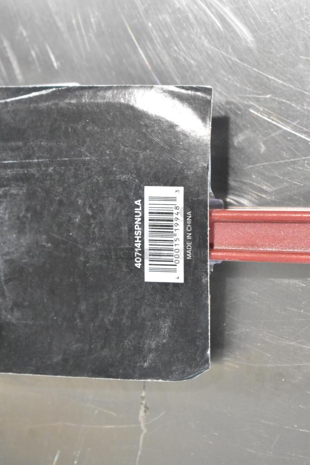 3 new Scratch and Dent Spoonulas with heat-resistant silicone blades, models 40714HSPNULA, 40714HSPTULA, 40710HSPTULA. Tags show barcode and "Made in China."