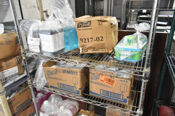 Two-tier lot with Purell 9217-02 sanitizing wipes, Diversey cleaner, Brighton soap refill. Boxes on metal shelves.