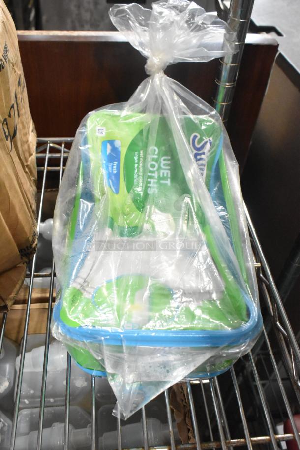 Two-tier lot with various items in a plastic bag, including hand sanitizing wipes. Items appear new in packaging.