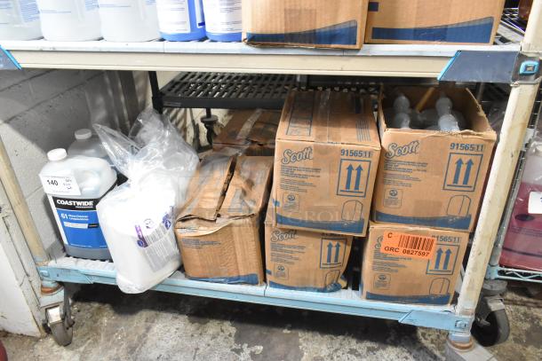 Tiered lot on shelf featuring Coastwide glass cleaner and Scott 91565 foam skin cleanser in boxes. Items appear unused.