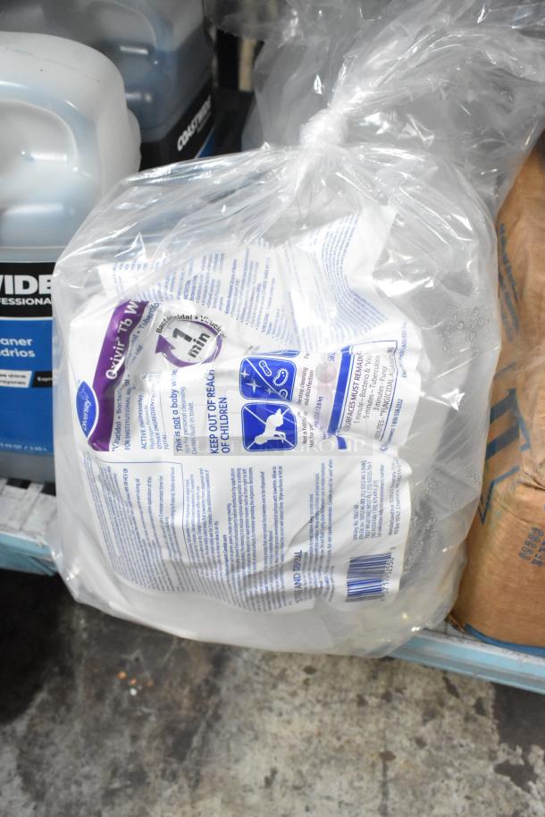 Lot of cleaning supplies including Coastwide glass cleaner and Scott 91565 foam skin cleanser, wrapped in plastic.