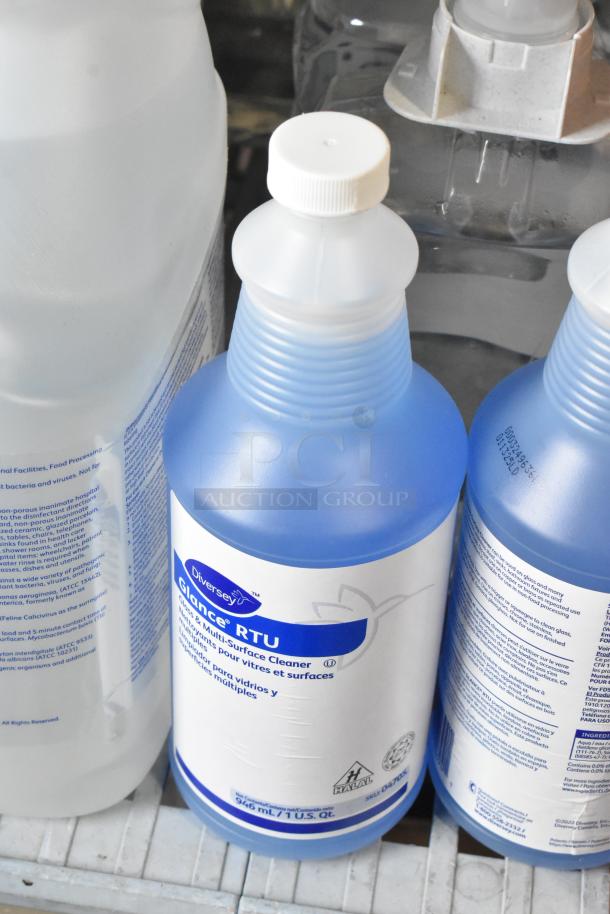 Assorted cleaning products including Scott Foam Skin Cleanser and Diversey Oxivir Tb Virucide Sanitizer, all bottles in good condition.