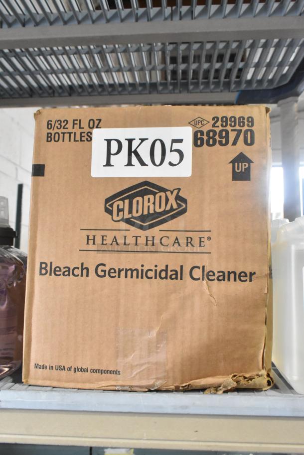 Cardboard box with Clorox Bleach Germicidal Cleaner label, volume 6/32 fl oz bottles, marked PK05, visibly worn edges.