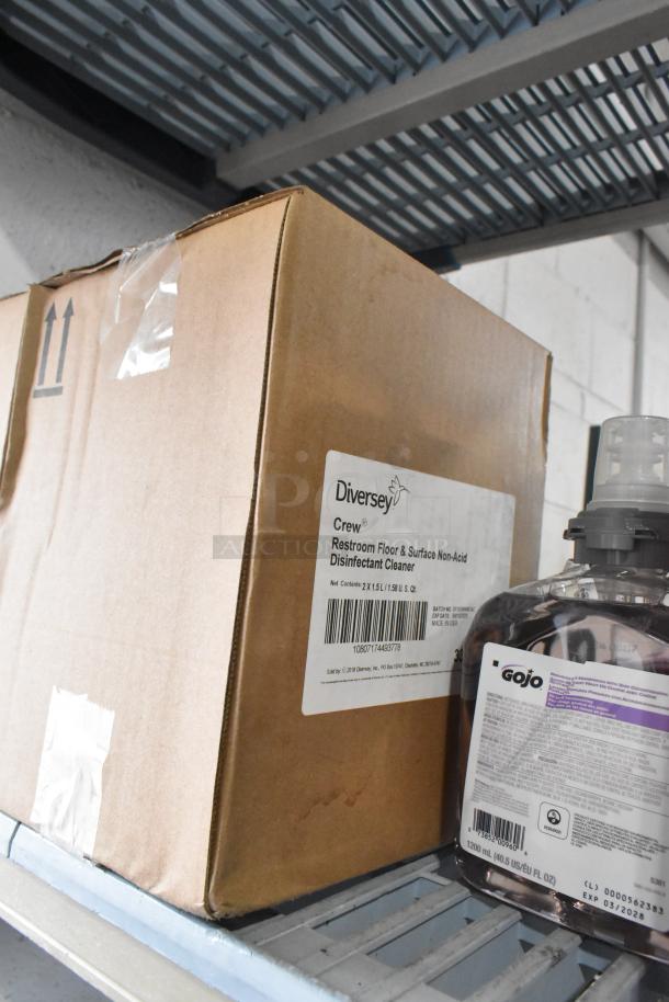 Box labeled Diversey Crew cleaner and Gojo handwash bottle on shelf.